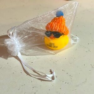 Rubber duck with glasses and bag
